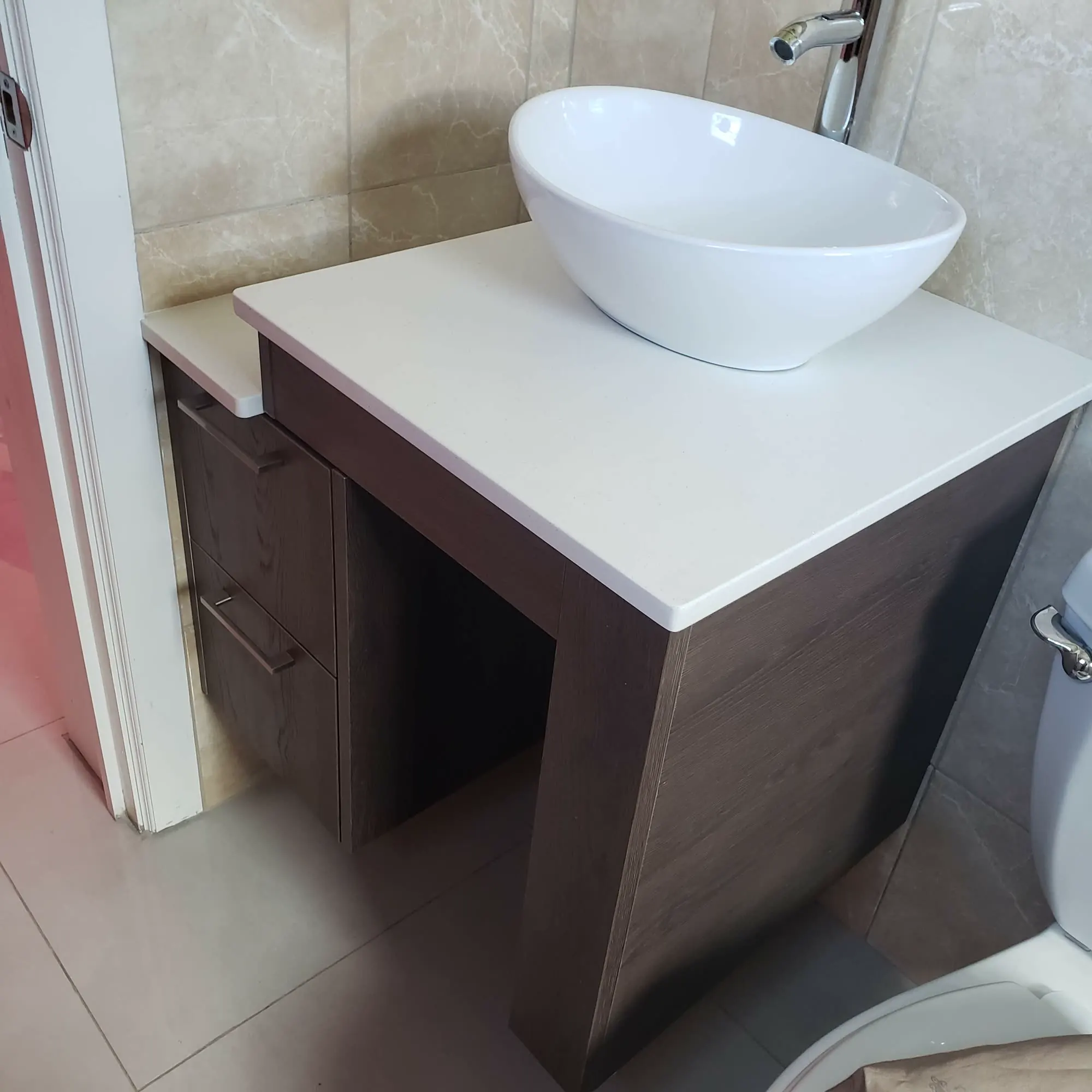 Integrated bathroom storage and mirror detailing in Nevis home