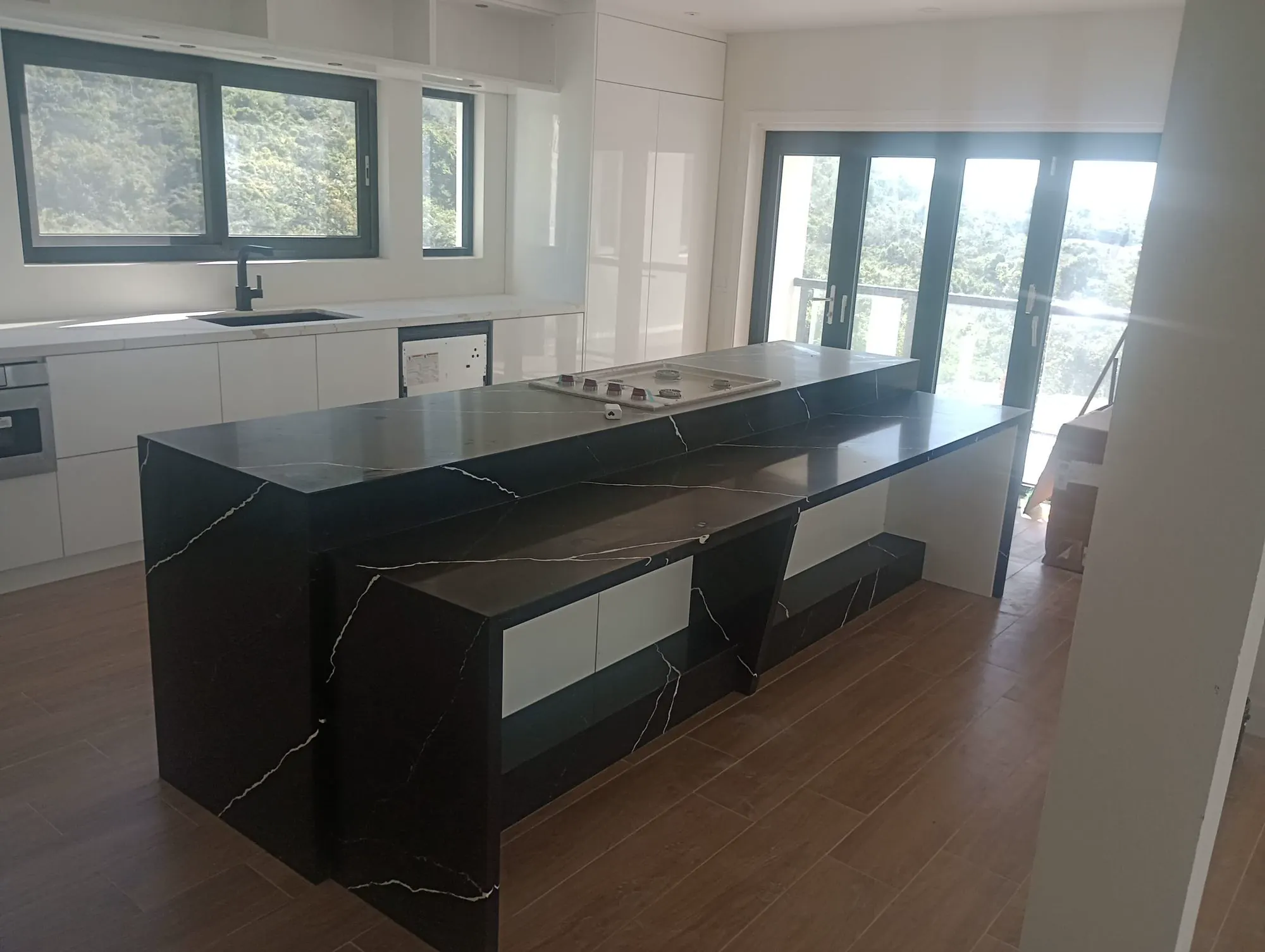 Superior Interiors craftsmen fitting custom kitchen cabinetry in Nevis