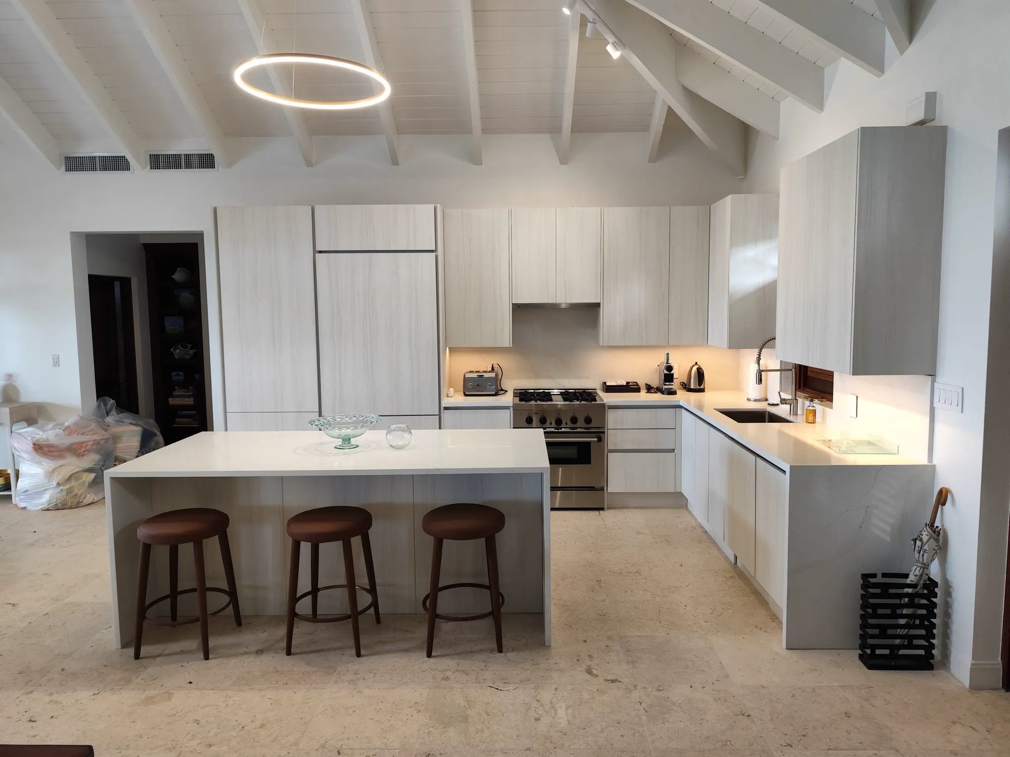 Custom kitchen island and cabinetry installation in Nevis home